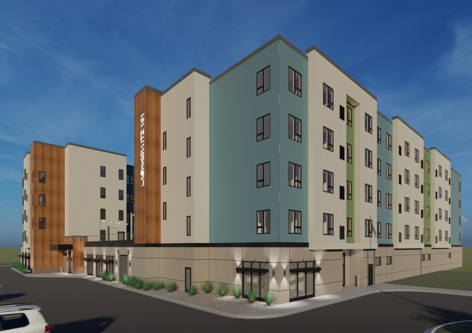 New Laketown 101 apartment building with modern, multi-colored facade under a clear blue sky
