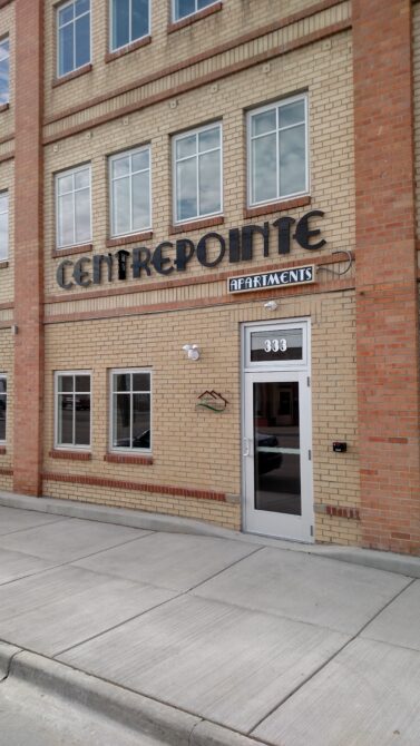 Centrepointe Apartments building entrance with address number 333 displayed above the door.
