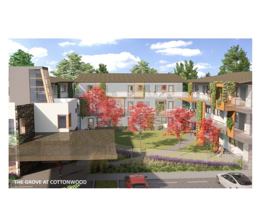 The Grove at Cottonwood apartment complex surrounded by red-leaved trees and greenery, featuring modern architecture and a courtyard.